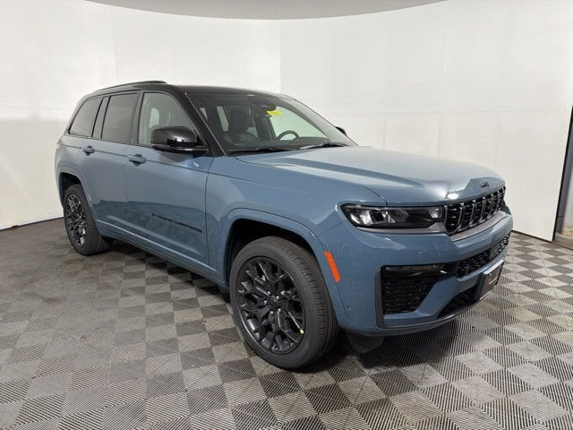 Blue Jeep Grand Cherokee at an angle in a photo booth